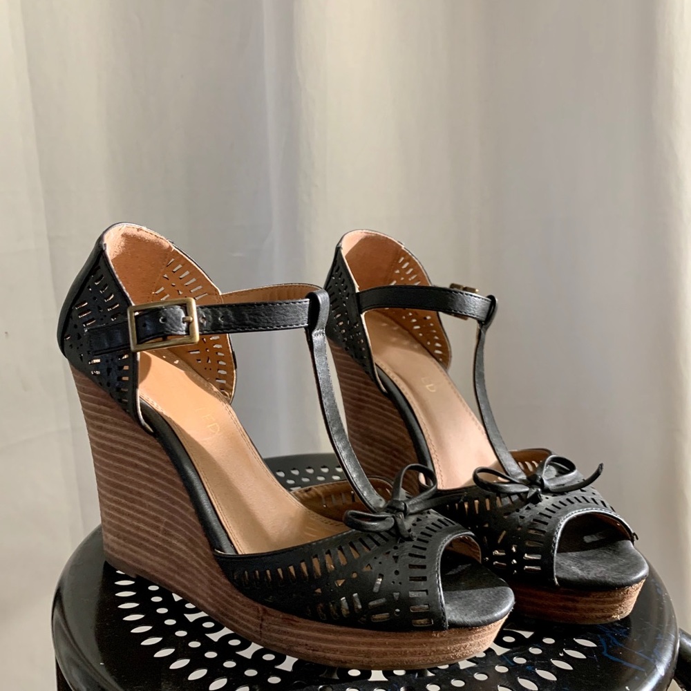 Restricted brand black wedges